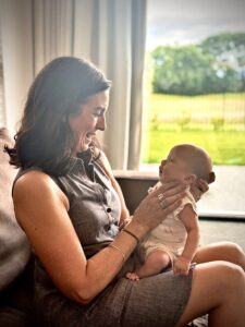 Christchurch Consultant Sarah holding baby